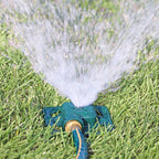 Melnor Square Spot Sprinkler spraying stream of water over green lawn