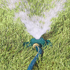 Melnor Square Spot Sprinkler spraying stream of water over green lawn