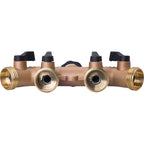 This is a brass plumbing manifold with multiple ports and black valves. Used for distributing water to various outlets, the fittings are symmetrical and robust.