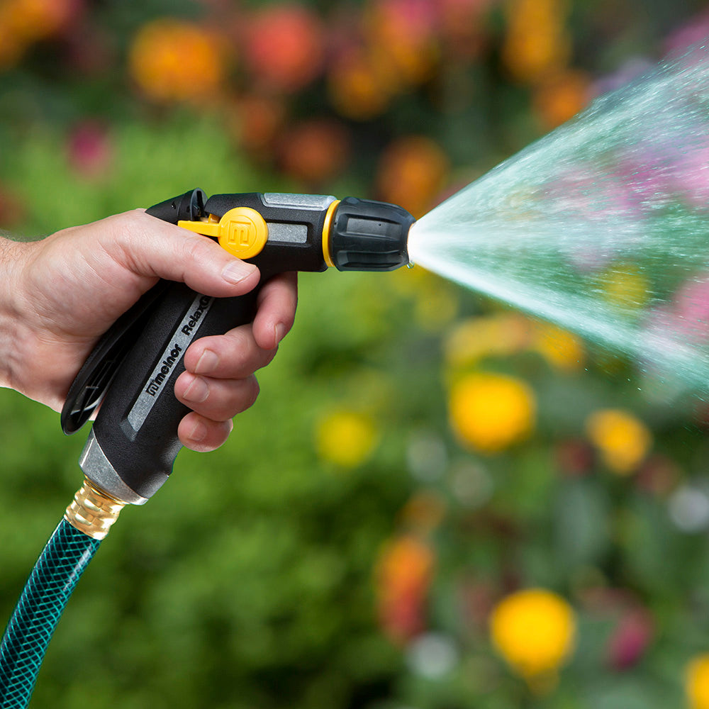 R200 Melnor RelaxGrip Adjustable Nozzle spraying water in front of colorful background